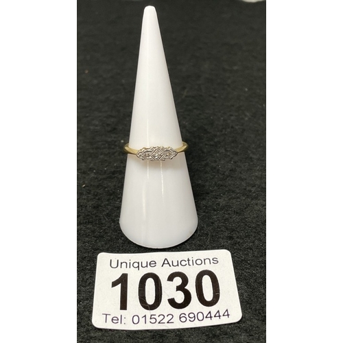 1030 - An 18ct gold and platinum trilogy diamind ring size M (total weight 2.39g)