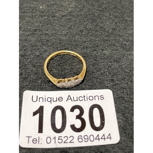 1030 - An 18ct gold and platinum trilogy diamind ring size M (total weight 2.39g)