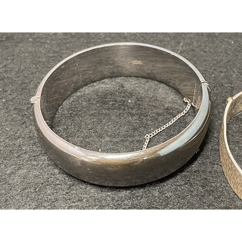 1033 - Two hallmarked Silver bangles (26g and 41.75g) and a .925 silver bangle (21.95) - total weight 89.7g