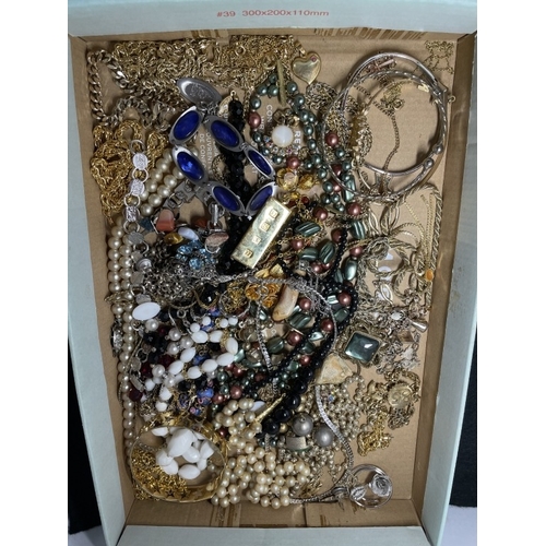 1037 - A good collection of costumew jewellery and gold coloured and silver coloured chains