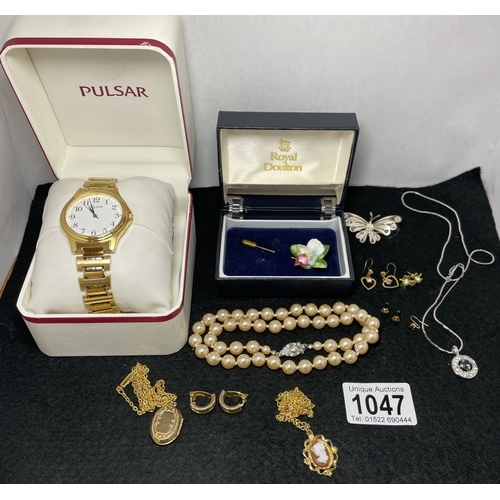 1047 - A boxed Pulsar watch and a quantity of costume jewellery