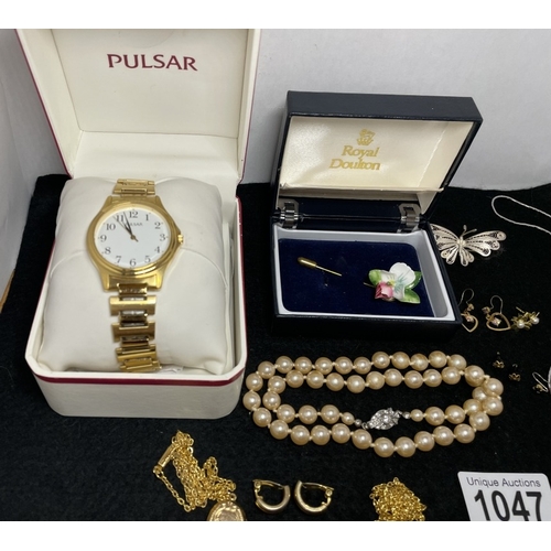 1047 - A boxed Pulsar watch and a quantity of costume jewellery