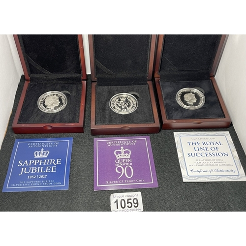 1059 - A collection of cased silver coins including 2013 Cook Islands 5 Dollars line of succession (28.28g)... 