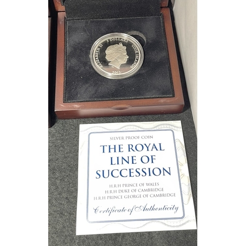 1059 - A collection of cased silver coins including 2013 Cook Islands 5 Dollars line of succession (28.28g)... 