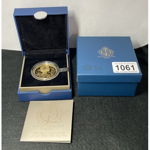 1061 - A cased 2012 Silver Proof Queens Diamond Jubilee £5 Coin plated fine gold with COA