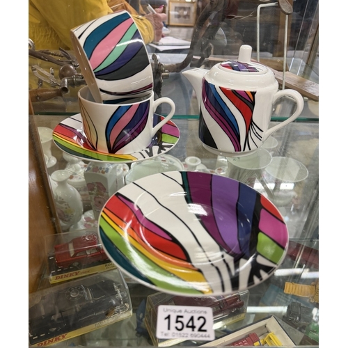 1542 - A quantity of vivid fine porcelain including 2 cups, 2 saucers & teapot