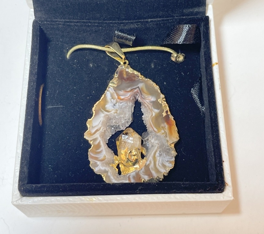 An 18kt gold plated agate geode pendant