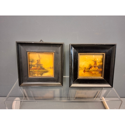 12 - Two Dutch late 19th early 20th century hand painted tiles in frames which measure 12.5cm x 12.5cm