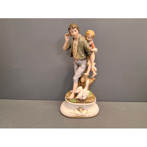 15 - An Ardalt lenwile China figure of a young man with child & goose at his feet