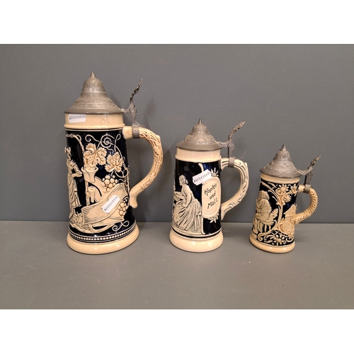 35 - Three vintage German beer steins with pewter tops.
Tallest one is 23cm