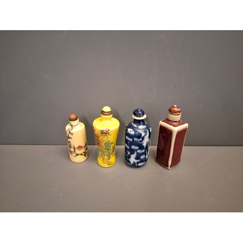 37 - Four Chinese vintage snuff bottles in various designs