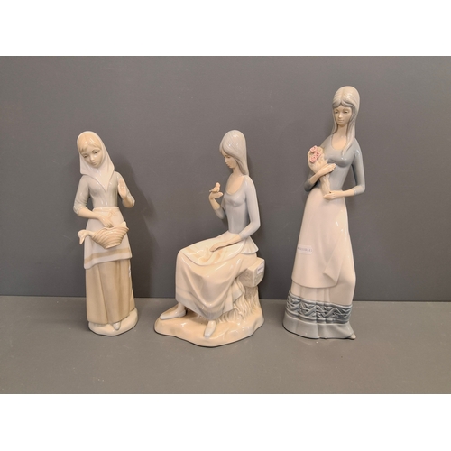 39 - Three Spanish porcelain lady figures two by Miguel the other by Perceval.
Tallest one is 33cm
