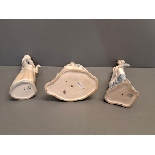 39 - Three Spanish porcelain lady figures two by Miguel the other by Perceval.
Tallest one is 33cm