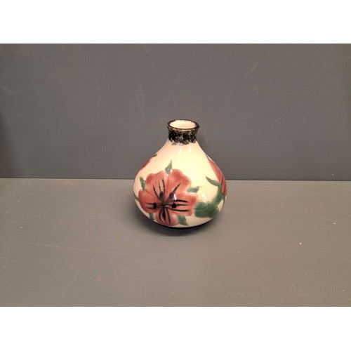 56 - Cobridge stoneware squat vase In the Corncockle pattern.
Height 9.5cm