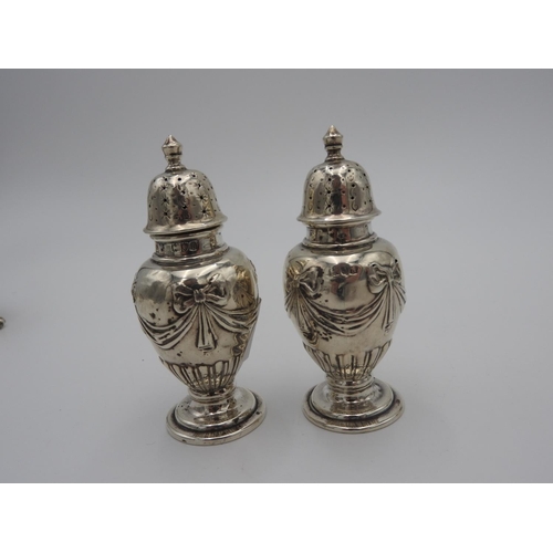 199 - PAIR OF GEORGE II SILVER SALTS LONDON 1742 with repousse decoration raised on three shell cast paw f... 