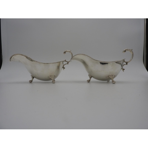 204 - PAIR VICTORIAN SILVER SAUCEBOATSSHEFFIELD, 1899 with gadrooned rims and double c-scroll handles, rai... 