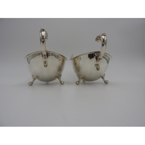 204 - PAIR VICTORIAN SILVER SAUCEBOATSSHEFFIELD, 1899 with gadrooned rims and double c-scroll handles, rai... 