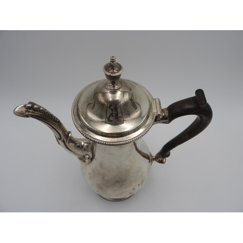 207 - GEORGE II SILVER COFFEE POTWILLIAM HOLMES, LONDON 1718with a scroll wood handle and urn shaped finia... 