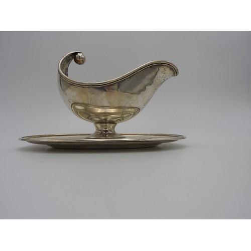 208 - CONTINENTAL SILVER GRAVY BOAT EARLY 20TH CENTURY of boat shape form, raised on an attached oval base... 