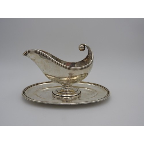 208 - CONTINENTAL SILVER GRAVY BOAT EARLY 20TH CENTURY of boat shape form, raised on an attached oval base... 