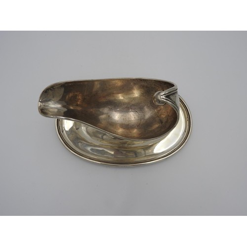 208 - CONTINENTAL SILVER GRAVY BOAT EARLY 20TH CENTURY of boat shape form, raised on an attached oval base... 