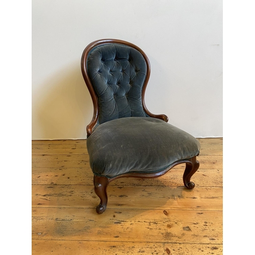 11 - VICTORIAN MAHOGANY SPOON BACK NURSING CHAIR upholstered in blue button back material on carved cabri... 