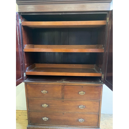 20 - EDWARDIAN MAHOGANY LINEN PRESS in two sections, with 2-door cupboard above containing three linen sl... 