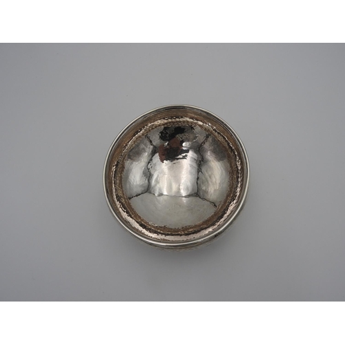 213 - ARTS AND CRAFTS SILVER BOWL ALBERT EDWARD JONES, BIRMINGHAM 1910the compressed ovoid bowl with hamme... 