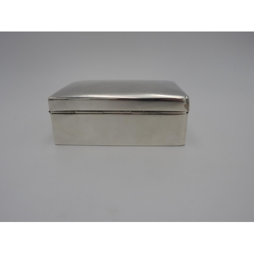 214 - GEORGE V SILVER CIGARETTE BOXWALKER & HALL, LONDON 1912of plain rectangular form13.5cm wide... 