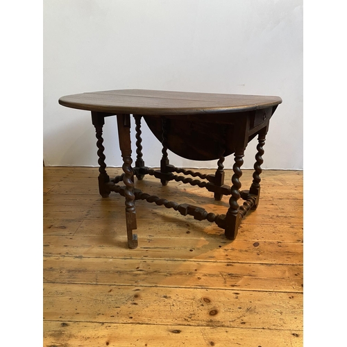 46 - OAK GATE LEG TABLE CHARLES II & LATER ON BARLEY TWIST LEGS WITH DRAWER140cm wide, 170cm long, 72... 