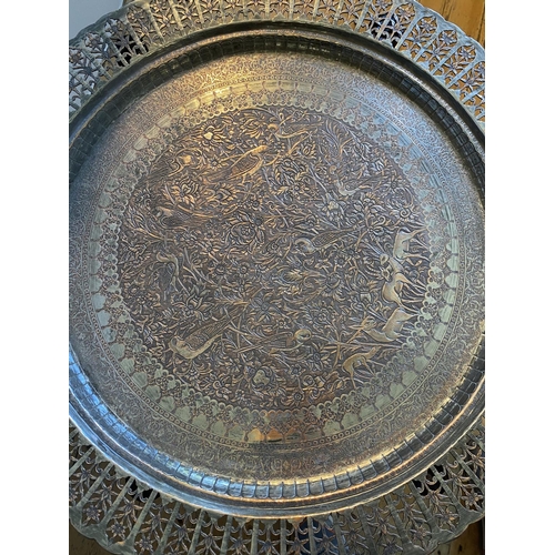 47 - PERSIAN SILVERED COPPER CIRCULAR TRAY ON FOLDING STAND CIRCA 190054cm high, 75cm dia