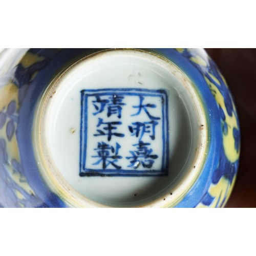 17 - YELLOW-GROUND AND UNDERGLAZE BLUE 'THREE FRIEND OF WINTER' WINE CUPJIAJING SIX CHARACTER MARK AND OF... 