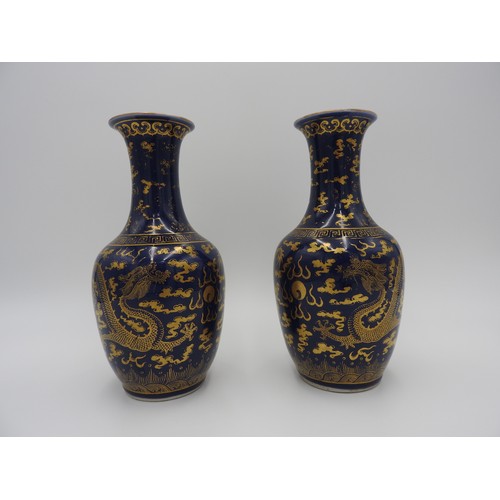 19 - PAIR OF POWDER BLUE AND GILT-DECORATED 'DRAGON' VASESGUANGXU SIX CHARACTER MARKS AND OF THE PERIODth... 