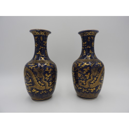 19 - PAIR OF POWDER BLUE AND GILT-DECORATED 'DRAGON' VASESGUANGXU SIX CHARACTER MARKS AND OF THE PERIODth... 