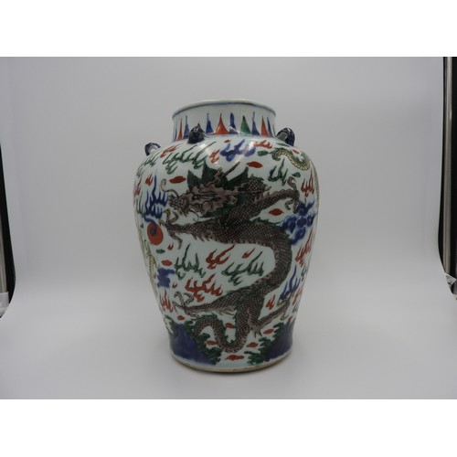 22 - WUCAI 'DRAGON' JARKANGXI PERIOD the baluster sides boldly painted in coloured enamels with ferocious... 