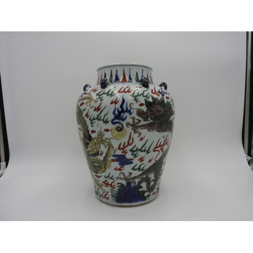 22 - WUCAI 'DRAGON' JARKANGXI PERIOD the baluster sides boldly painted in coloured enamels with ferocious... 