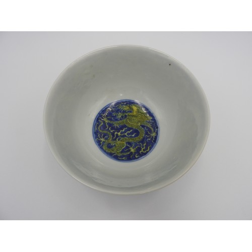 24 - UNDERGLAZE-BLUE AND YELLOW ENAMEL 'DRAGON' BOWLKANGXI SIX CHARACTER MARK AND OF THE PERIODpainted wi... 