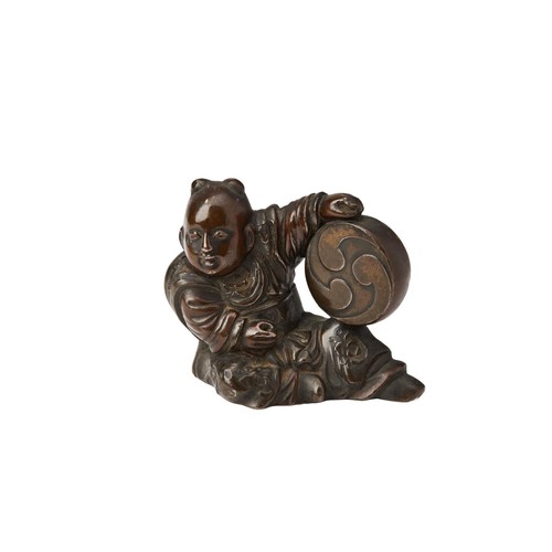 96 - BRONZE SCROLL WEIGHTQING DYNASTY, 19TH CENTURYmodelled as a seated boy holding a drum5cm highPROVENA... 