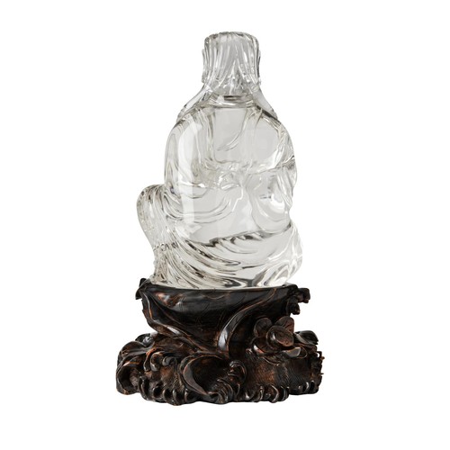 169 - LARGE ROCK CRYSTAL FIGURE GUANYIN ON A CARVED HARDWOOD STANDQING DYNASTY, 19TH CENTURYthe seated dei... 