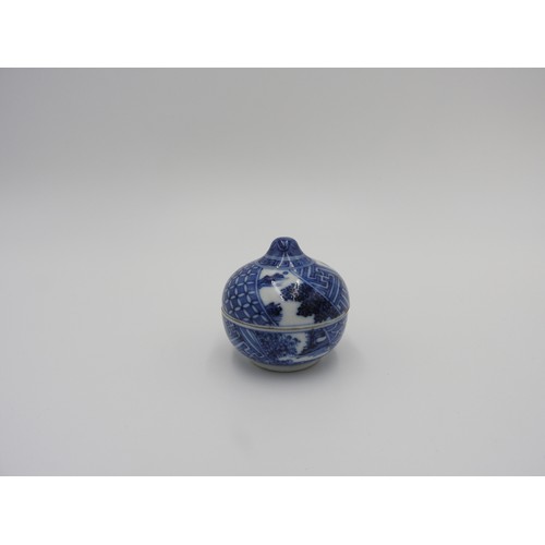 621 - JAPANESE BLUE AND WHITE CIRCULAR BOX AND COVER MEIJI PERIODthe sides painted with radiating panels o... 