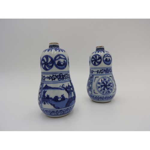 622 - PAIR OF BLUE AND WHITE DOUBLE GOURD BOTTLES MEIJI PERIOD the sides painted in tones of underglaze bl... 