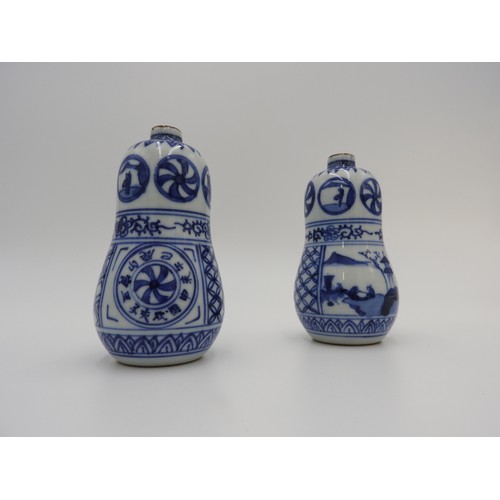 622 - PAIR OF BLUE AND WHITE DOUBLE GOURD BOTTLES MEIJI PERIOD the sides painted in tones of underglaze bl... 