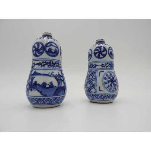 622 - PAIR OF BLUE AND WHITE DOUBLE GOURD BOTTLES MEIJI PERIOD the sides painted in tones of underglaze bl... 