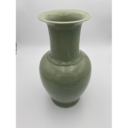 365 - CELADON-GLAZED VASELATE QING / REPUBLIC PERIODthe baluster sides with incised decoration 38cm high... 