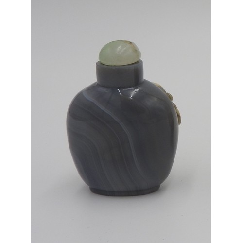 321 - CARVED AGATE SNUFF BOTTLEQING DYNASTY, 19TH CENTURYcarved in high relief with a chilong and lingzhi ... 