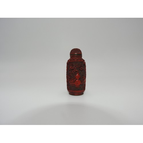 322 - CINNABAR LACQUER AND GILT-METAL SNUFF BOTTLELATE QING / REPUBLIC PERIODwith a apocryphal Qianlong se... 