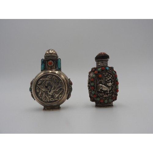 325 - TWO TIBETAN SILVER AND HARDSTONE SNUFF BOTTLESLATE 19TH CENTURYeach set with turquoise and coral 'je... 