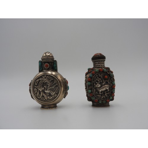 325 - TWO TIBETAN SILVER AND HARDSTONE SNUFF BOTTLESLATE 19TH CENTURYeach set with turquoise and coral 'je... 