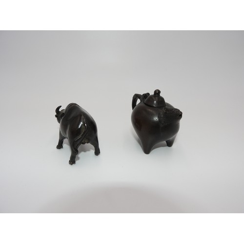 264 - TWO BRONZE WATER DROPPERSQING DYNASTYone in the form a a teapot, the other a buffalo 5cm & 7cm h... 