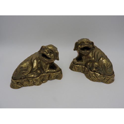 267 - PAIR OF GILT BRONZE BUDDHIST LIONSQING DYNASTY, 19TH CENTURYthe recumbent male and female beasts rai... 